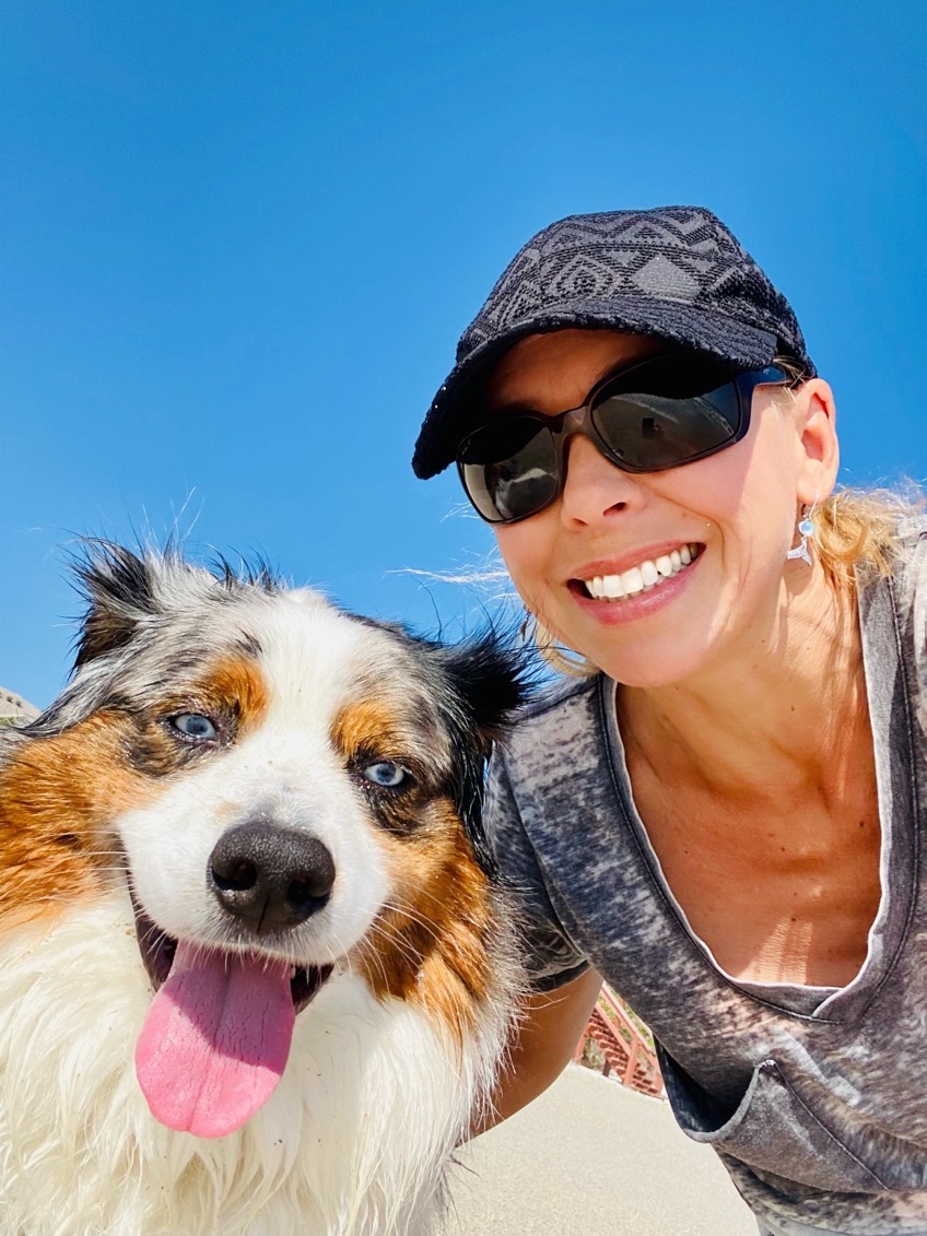 Australian shepherd with caretaker outdoors